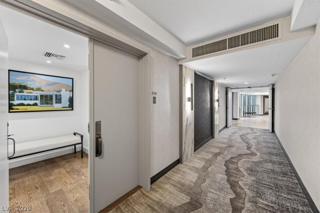 3111 Bel Air Drive, #7D, Las Vegas, NV 89109 An inviting entrance foyer transitions smoothly into a wide hallway with decorative patterned flooring.