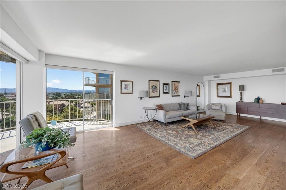 3111 Bel Air Drive, #7D, Las Vegas, NV 89109 Sliding glass doors open to a private balcony overlooking neighborhood vistas from this living space.