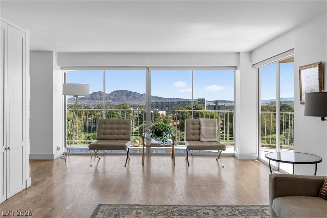3111 Bel Air Drive, #7D, Las Vegas, NV 89109 Floor-to-ceiling glass doors open to a private balcony overlooking majestic mountain views.