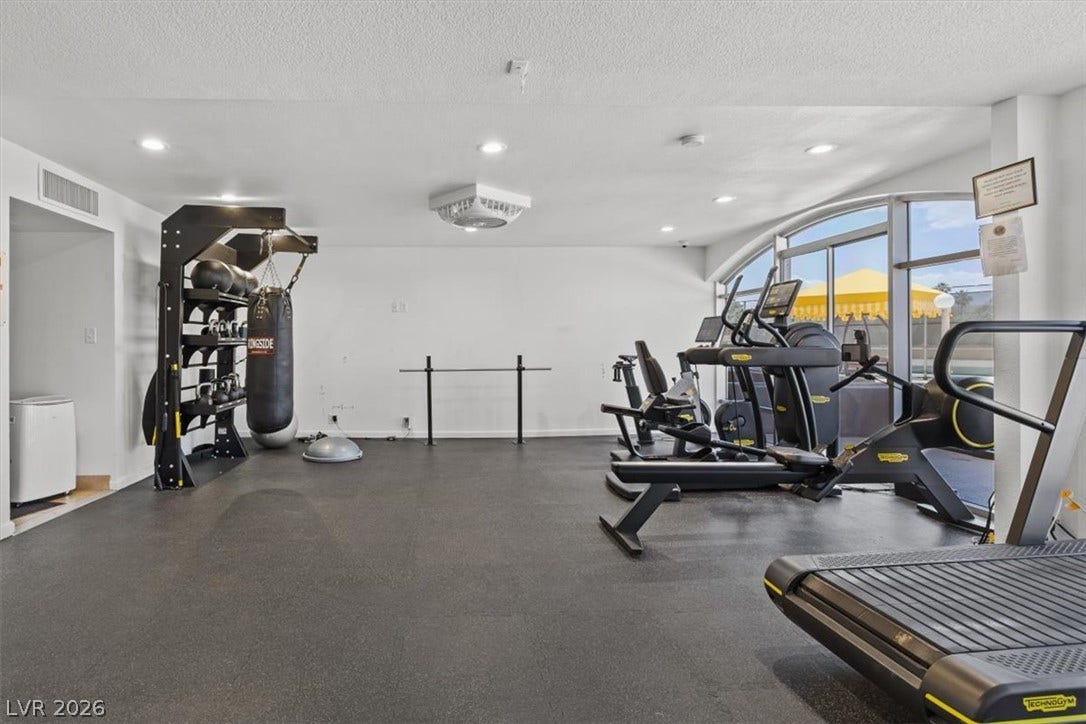 3111 Bel Air Drive, #7D, Las Vegas, NV 89109 An arched window wall illuminates this spacious fitness center complete with rubber flooring.