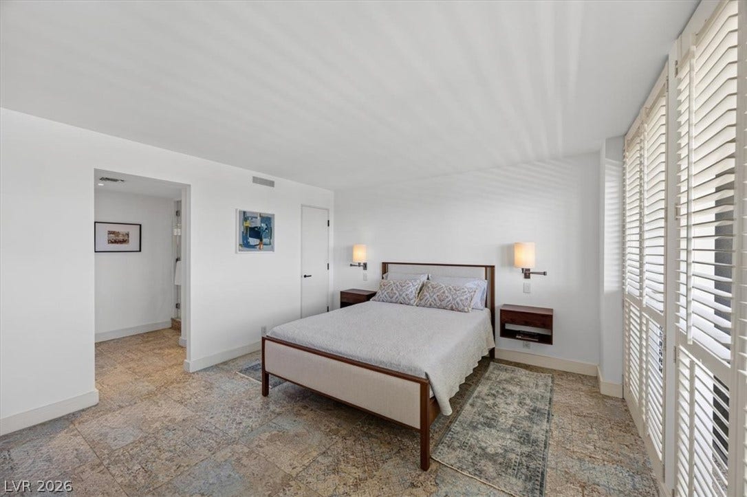 3111 Bel Air Drive, #7D, Las Vegas, NV 89109 Elegant tile flooring and plantation shutters define this serene primary suite.