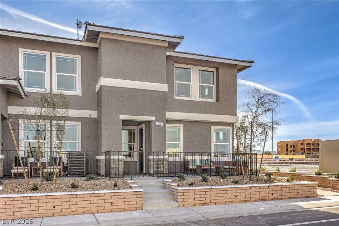 923 Black Heron Street, Henderson, NV 89011 A modern multi-level exterior displays clean architectural lines under a clear sky.