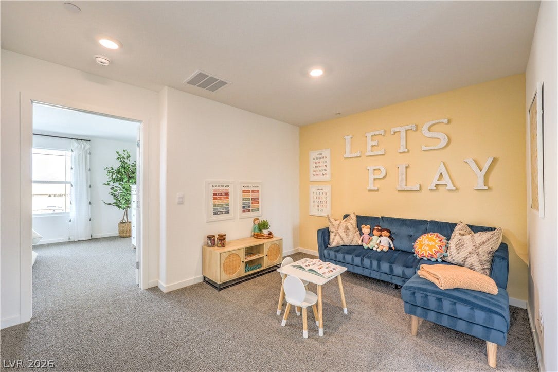 923 Black Heron Street, Henderson, NV 89011 Recessed lighting and soft carpeting create a cozy, inviting atmosphere in this versatile bonus space.