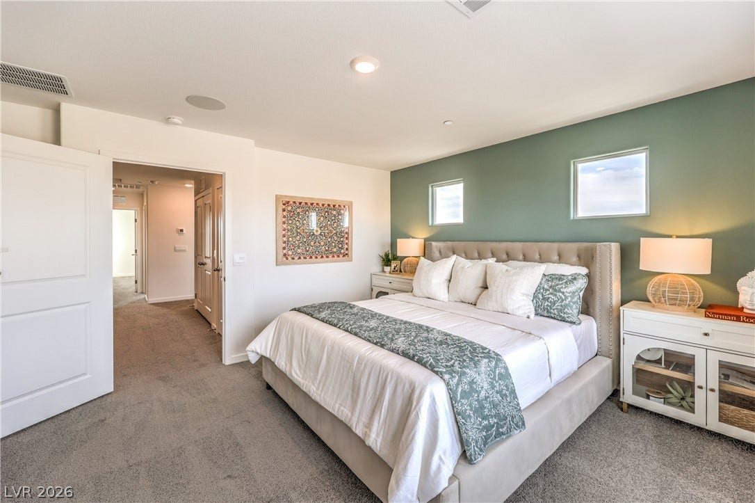 923 Black Heron Street, Henderson, NV 89011 Plush wall-to-wall carpeting and high ceilings define this comfortable second-floor bedroom suite.