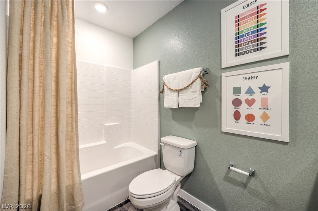 923 Black Heron Street, Henderson, NV 89011 Modern tile surrounds the tub in this well-appointed bathroom.