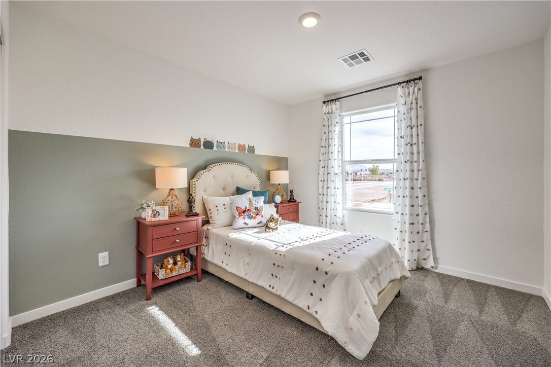 923 Black Heron Street, Henderson, NV 89011 A single window provides natural illumination to this comfortable bedroom featuring wall-to-wall carpeting.