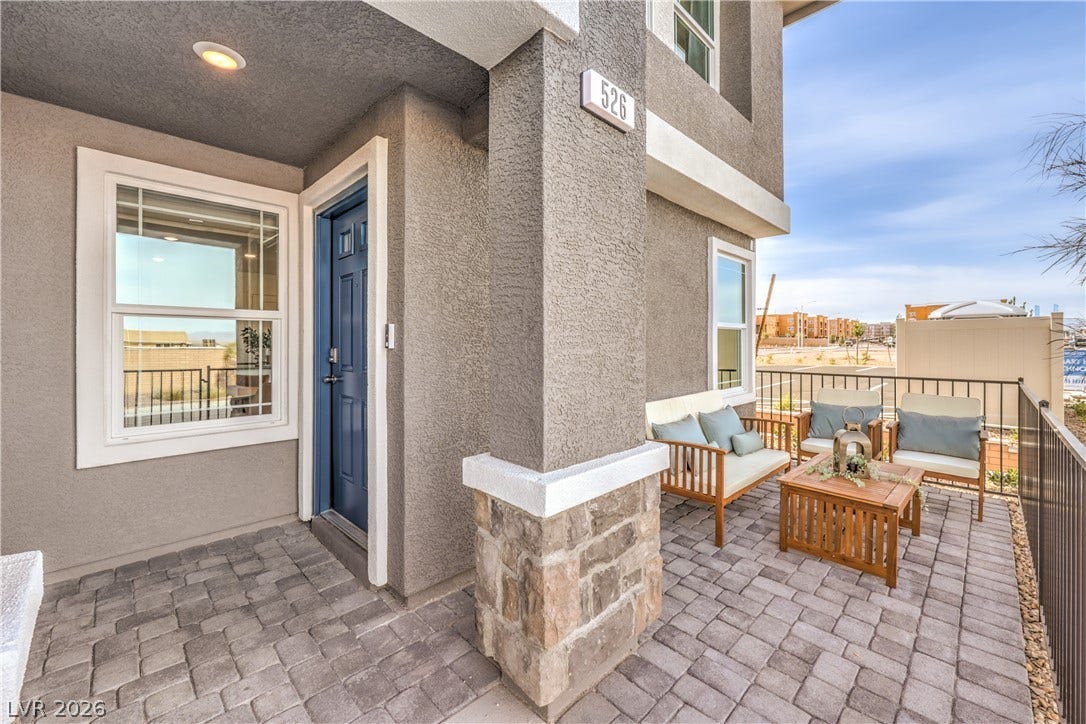 923 Black Heron Street, Henderson, NV 89011 Welcoming stone and stucco details define the entry and paved patio of this modern home.