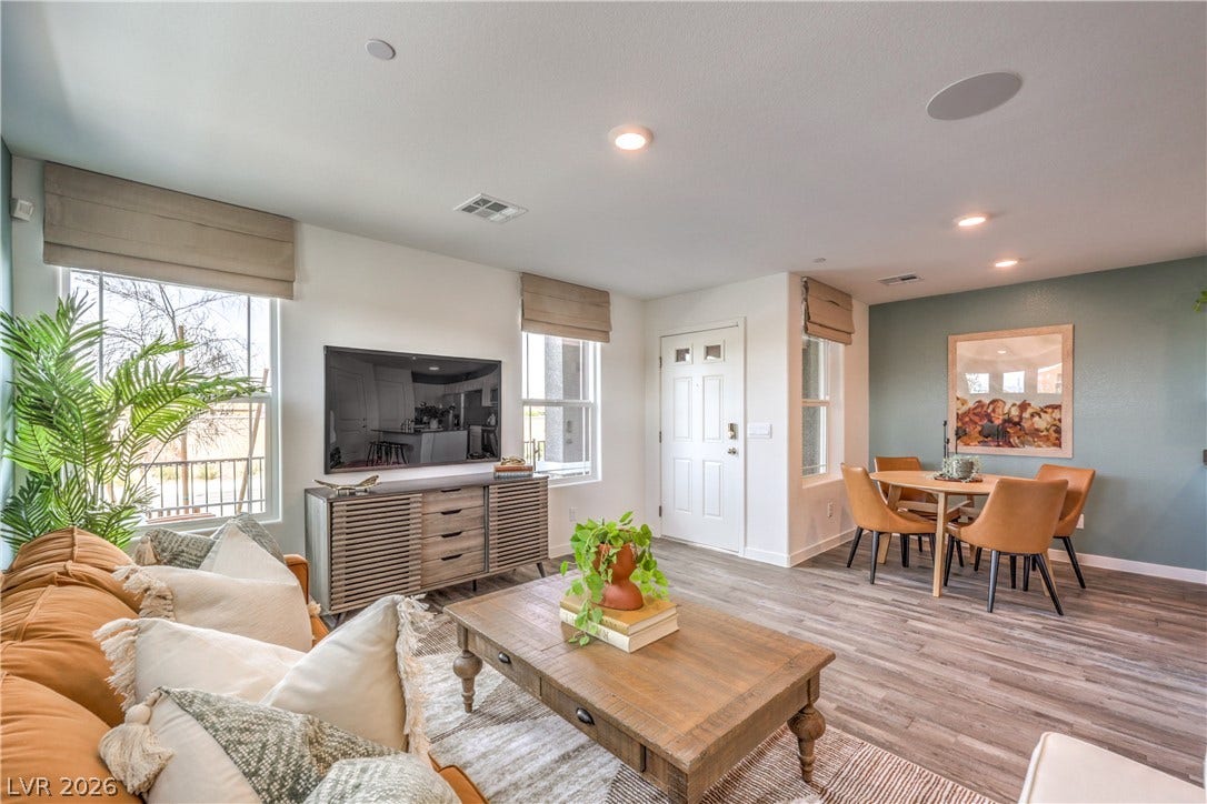 923 Black Heron Street, Henderson, NV 89011 Smooth wood floors flow through this light-filled open living area into a cozy dining space.
