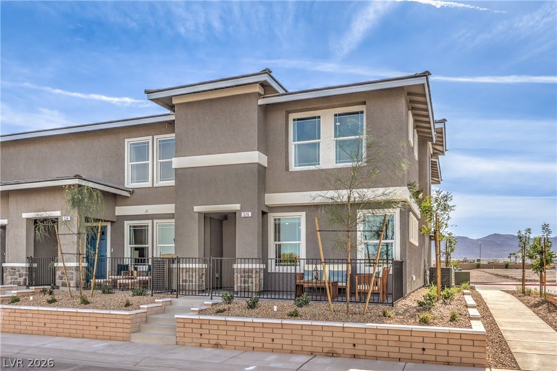 923 Black Heron Street, Henderson, NV 89011 A modern multi-level exterior stands out against a clear blue sky.