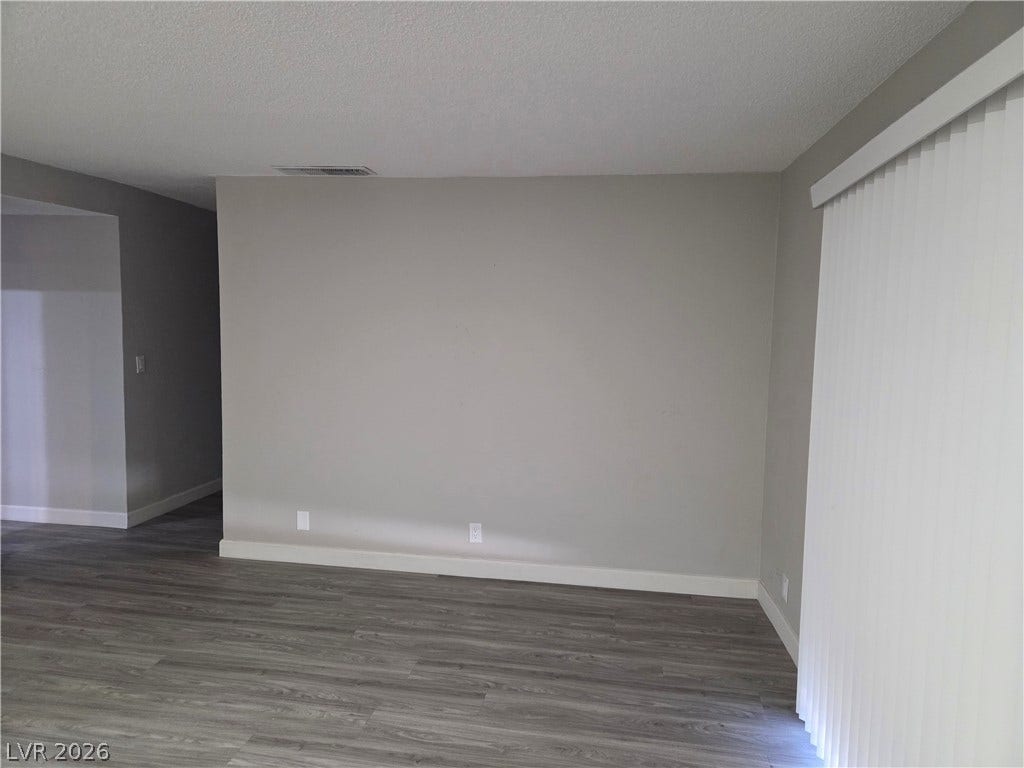 4364 Calimesa Street, Las Vegas, NV 89115 Smooth vinyl plank flooring pairs with clean lines in this versatile living space.