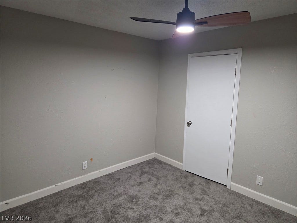 4364 Calimesa Street, Las Vegas, NV 89115 Plush wall-to-wall carpeting and clean baseboards define this versatile secondary room.