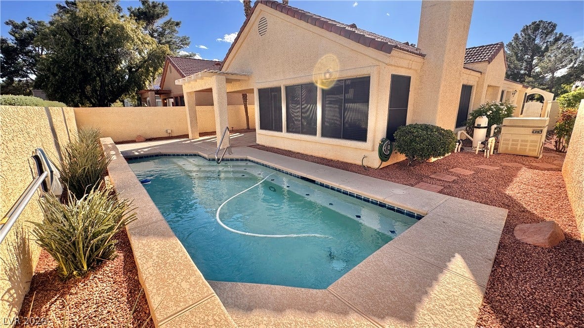 5236 Crooked River Circle, Las Vegas, NV 89149 An inviting private pool anchors the low-maintenance backyard of this tile-roofed desert home.