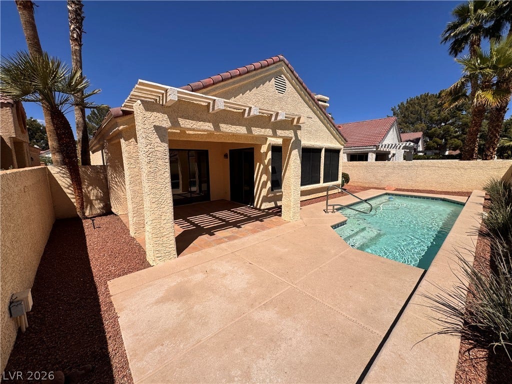 5236 Crooked River Circle, Las Vegas, NV 89149 An inviting private pool anchors the low-maintenance desert backyard under clear blue skies.