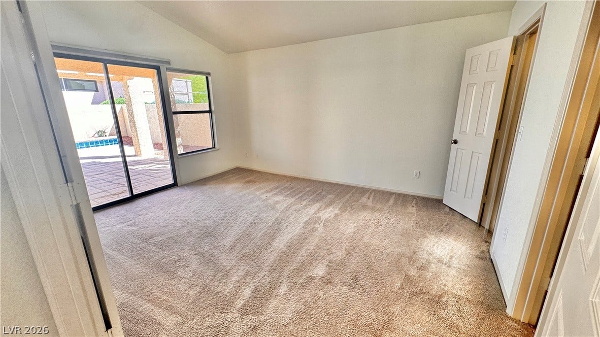 5236 Crooked River Circle, Las Vegas, NV 89149 Sliding glass doors open directly to the sunny patio from this comfortable bedroom.