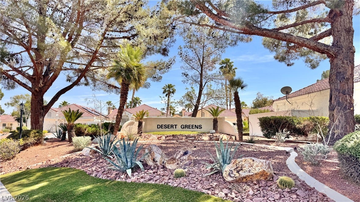 5236 Crooked River Circle, Las Vegas, NV 89149 Mature trees and desert landscaping frame the entryway to this established neighborhood.