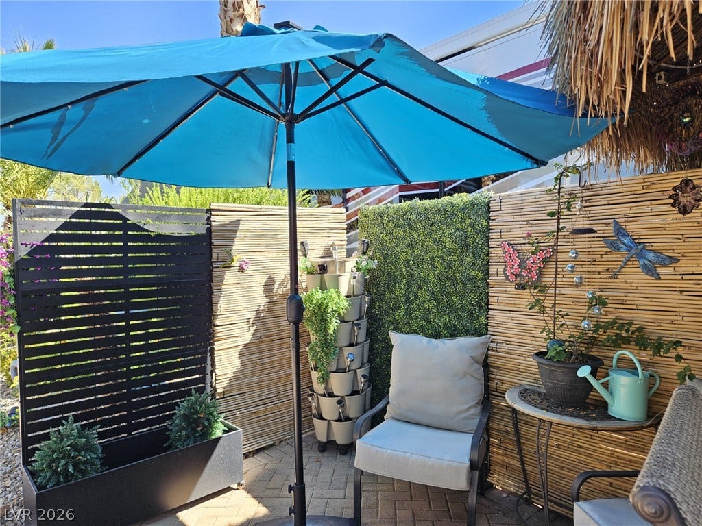 8175 Arville Street, #305, Las Vegas, NV 89139 An inviting paved patio area is enclosed by privacy fencing.