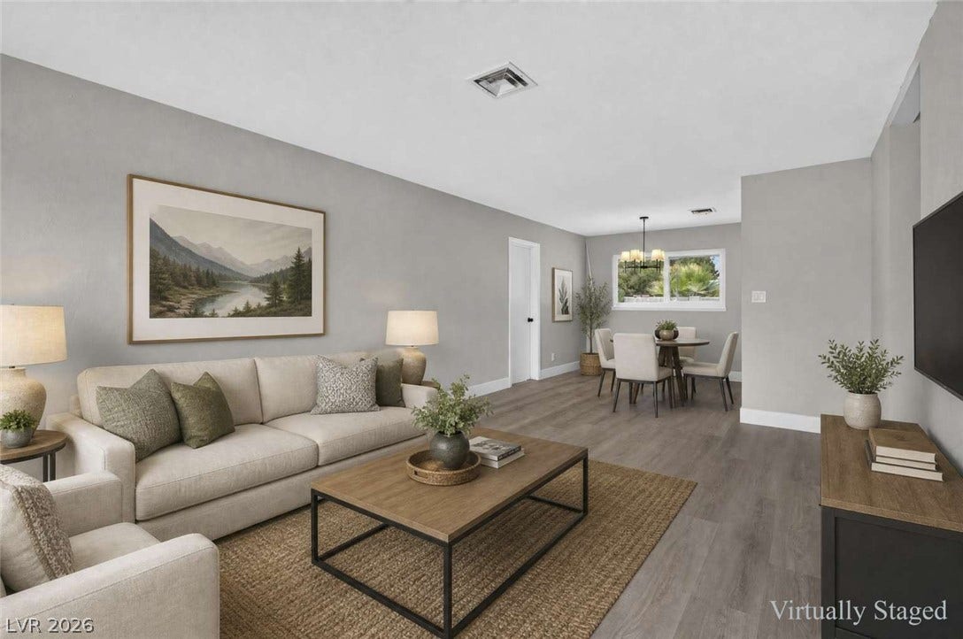 1669 N G Street, Las Vegas, NV 89106 Clean lines and smooth plank floors define this open concept living and dining layout.