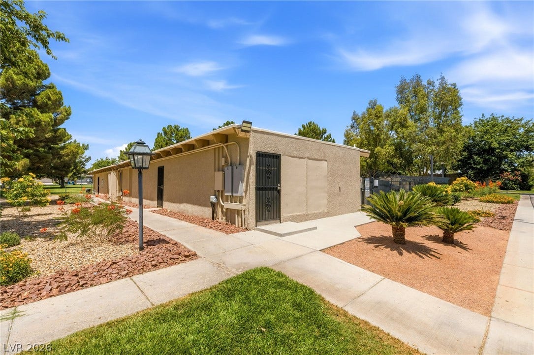 3471 One Nation Avenue, Las Vegas, NV 89121 Mature trees and low-maintenance landscaping create an inviting exterior for this building.