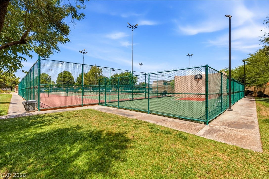 3471 One Nation Avenue, Las Vegas, NV 89121 Green space envelops this community sport court, complete with chain link fencing and towering light posts.