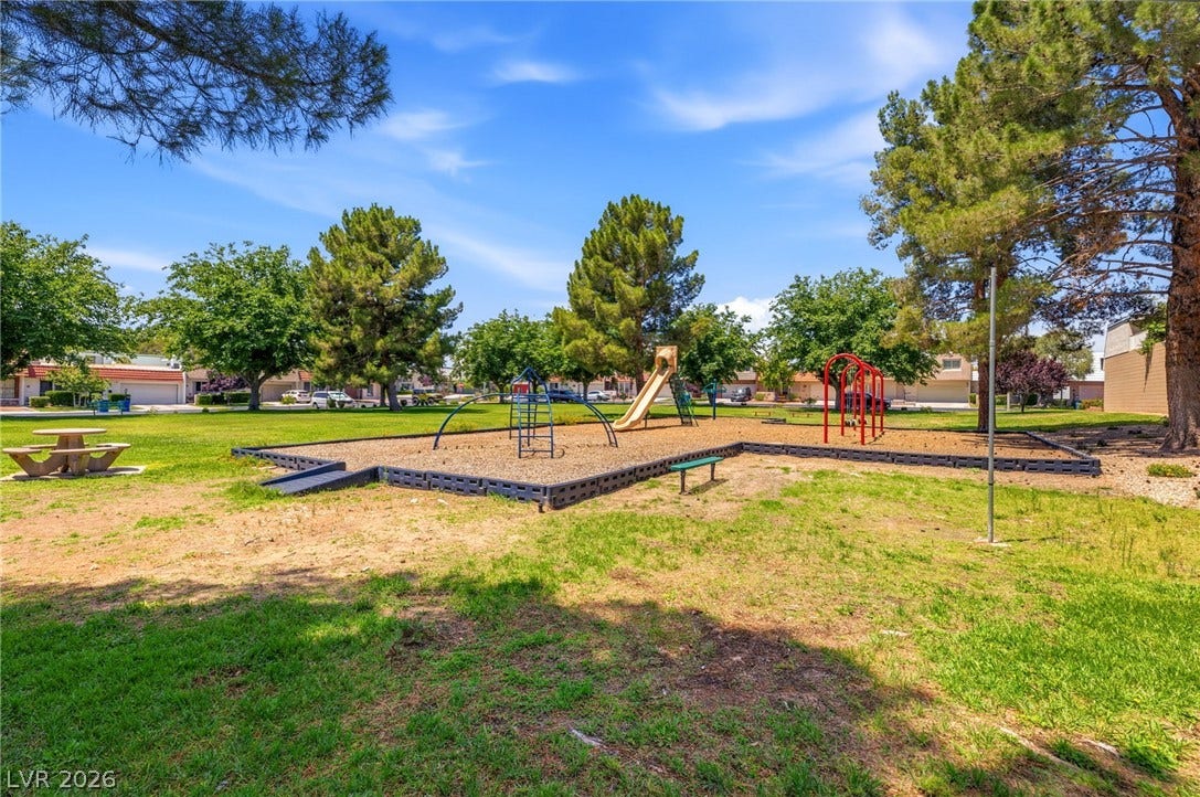 3471 One Nation Avenue, Las Vegas, NV 89121 A community park with a playground offers recreational opportunities amidst lush greenery.