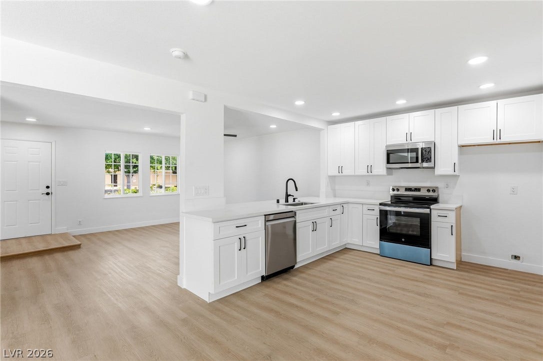 3471 One Nation Avenue, Las Vegas, NV 89121 A well-appointed kitchen features abundant cabinetry, stainless appliances, and seamless access to living areas.