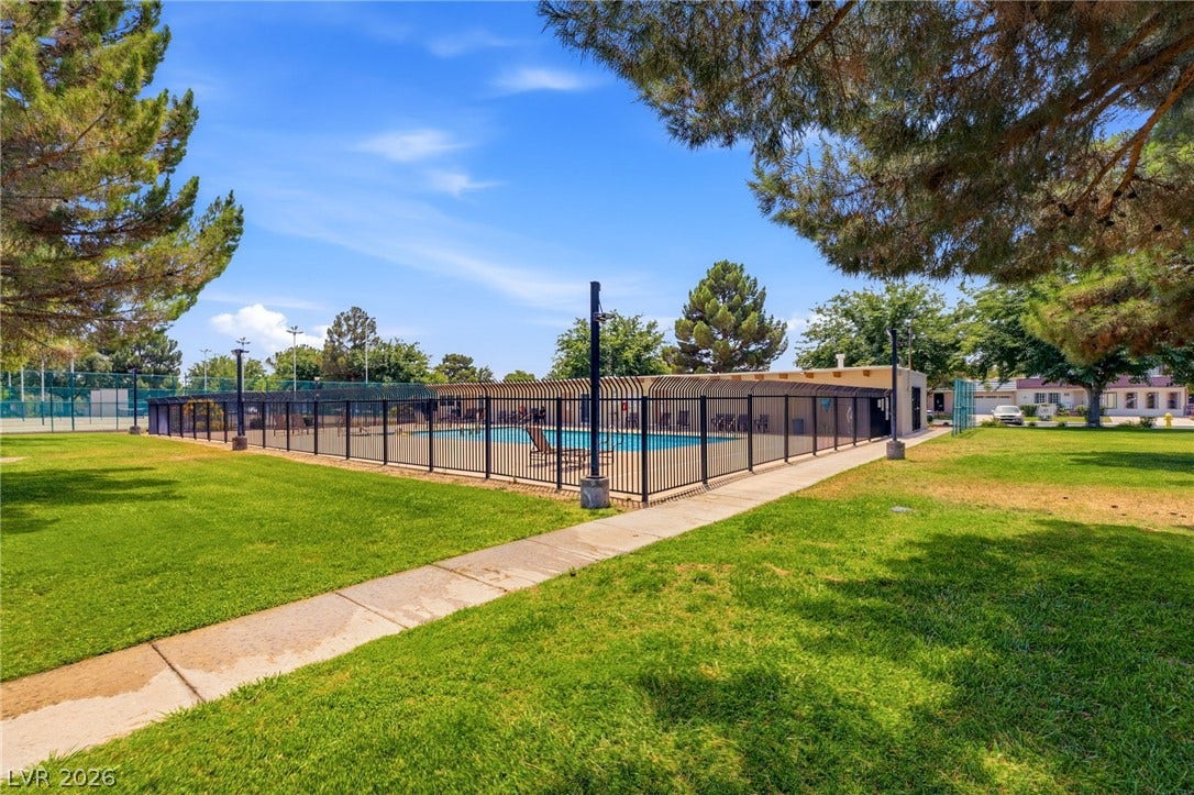 3471 One Nation Avenue, Las Vegas, NV 89121 A community pool with a tennis court, perfect for recreation and relaxation.