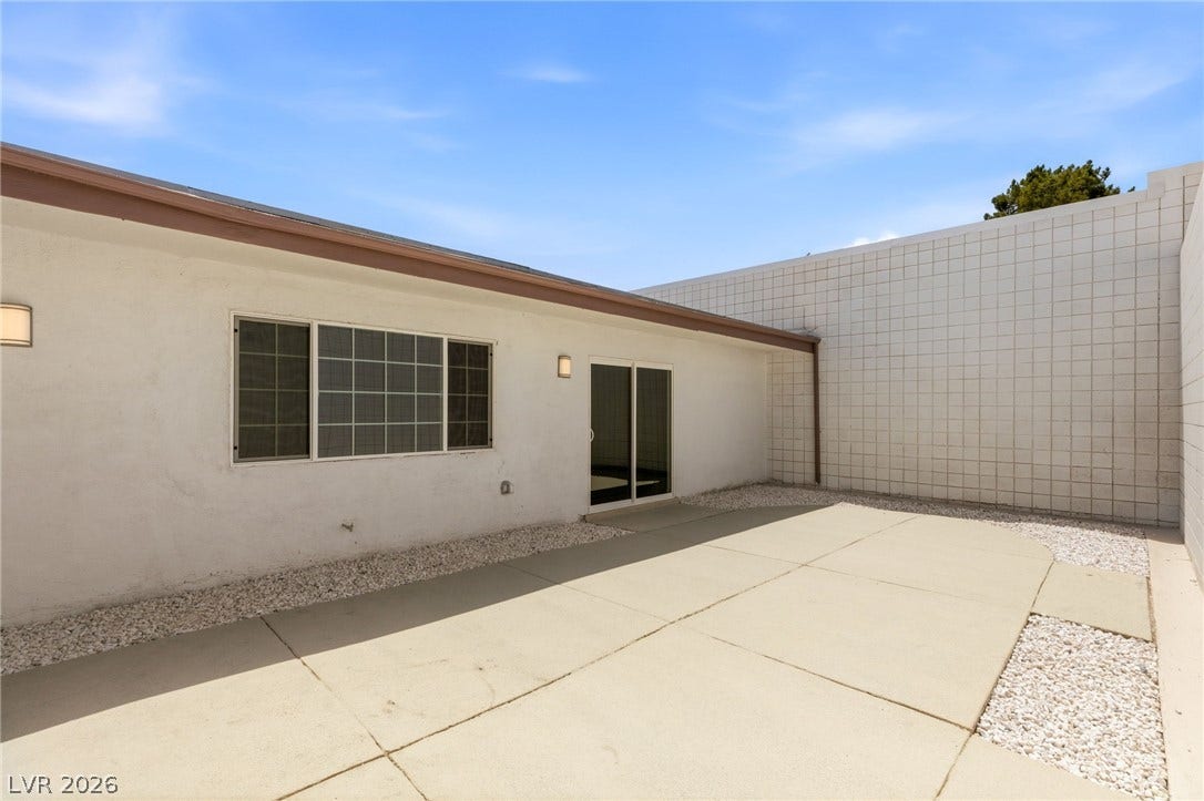 3471 One Nation Avenue, Las Vegas, NV 89121 A private courtyard provides seamless indoor-outdoor living, ideal for relaxed entertaining or tranquil moments.