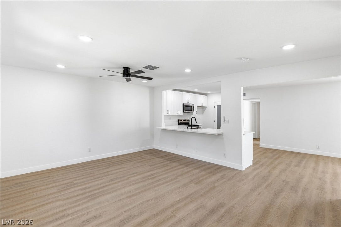 3471 One Nation Avenue, Las Vegas, NV 89121 A well-lit open-concept living area with clean, modern finishes and integrated kitchen access.