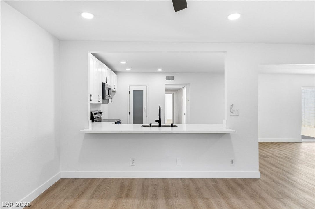 3471 One Nation Avenue, Las Vegas, NV 89121 An open concept kitchen features sleek appliances and ample counter space, perfect for entertaining.