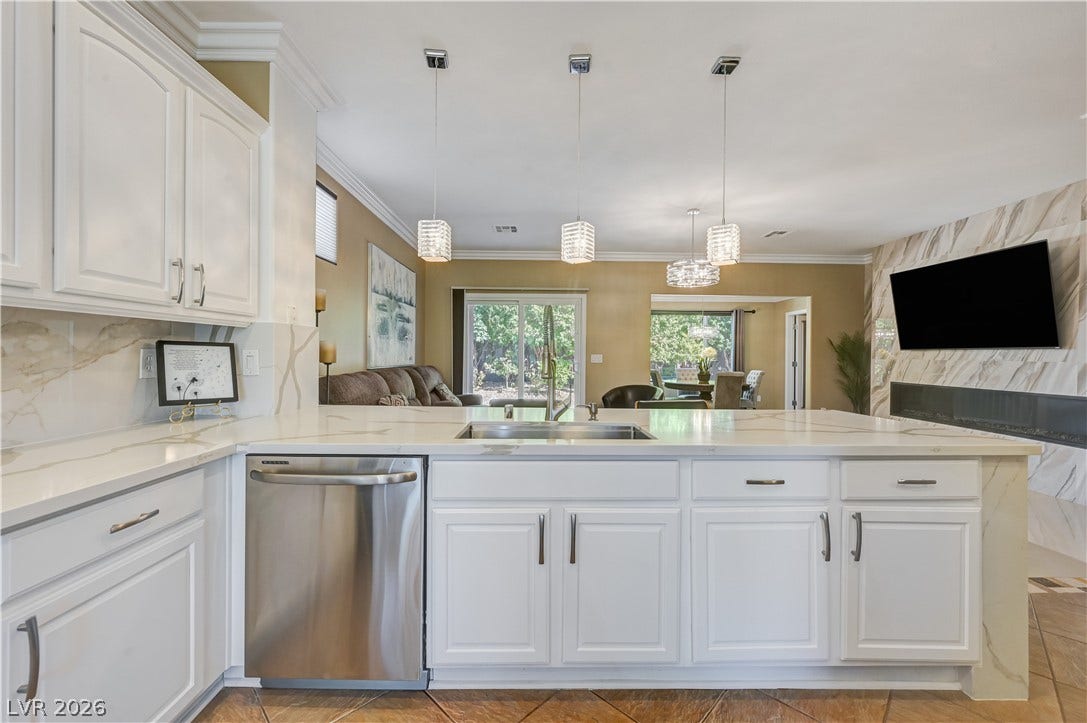 An open floor plan connects the kitchen island to the inviting living areas.