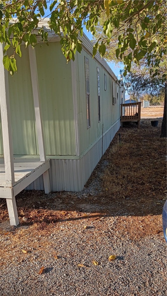 3490 E Savoy Boulevard, Pahrump, NV 89061 Mature trees shade the exterior of this single-level manufactured home.