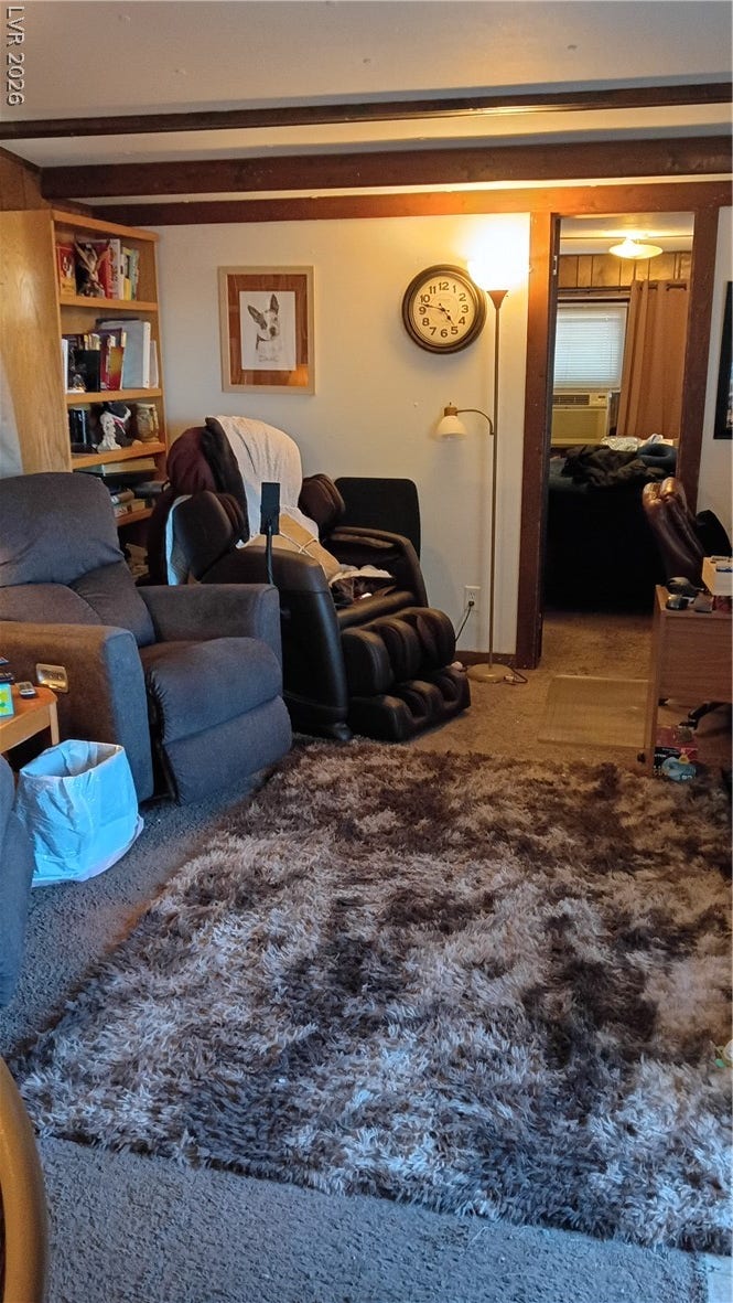 3490 E Savoy Boulevard, Pahrump, NV 89061 Exposed ceiling beams bring rustic texture to this comfortable living area.