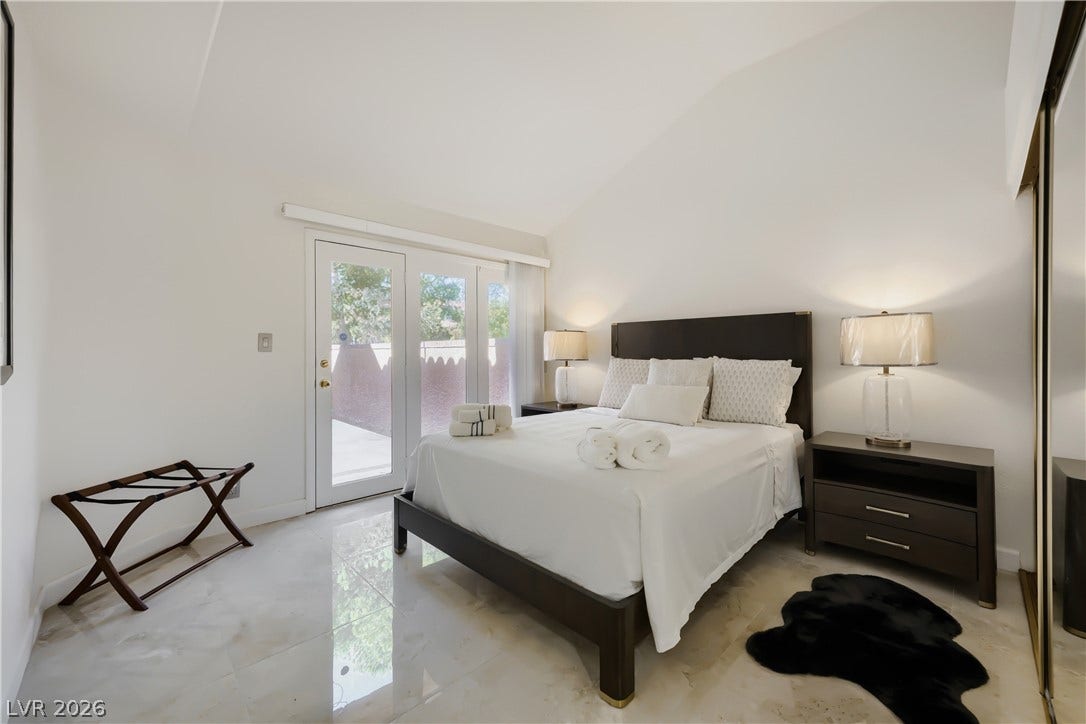 Guest bedroom downstairs with backyard access