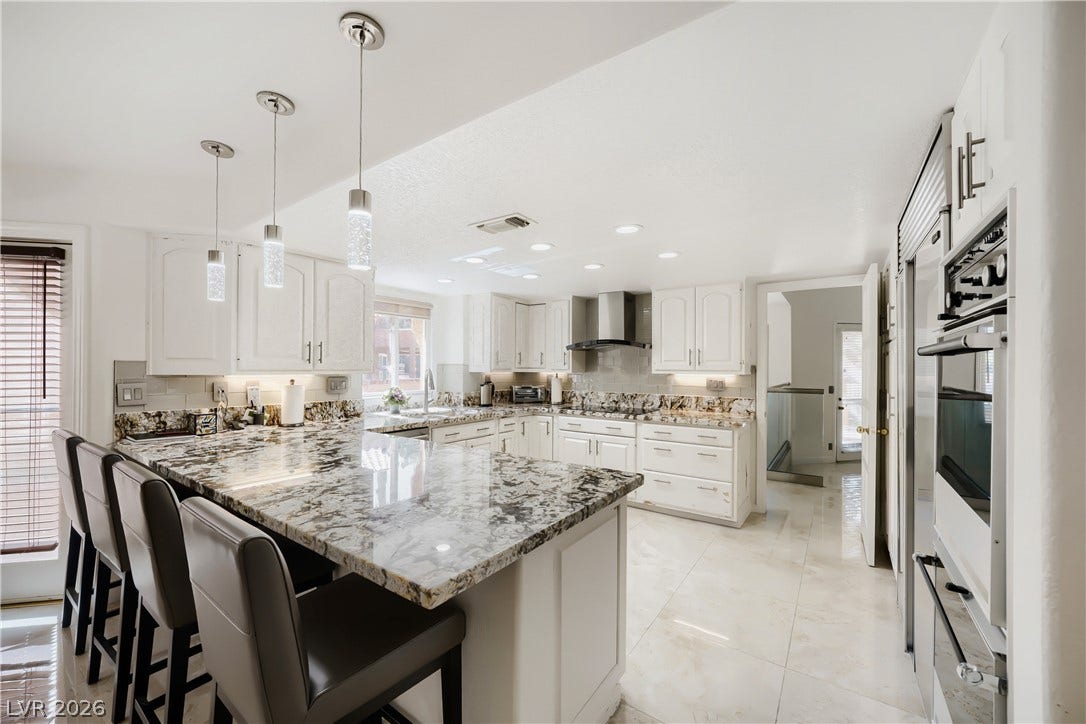 Kitchen with Breakfast Bar and Granite Counters