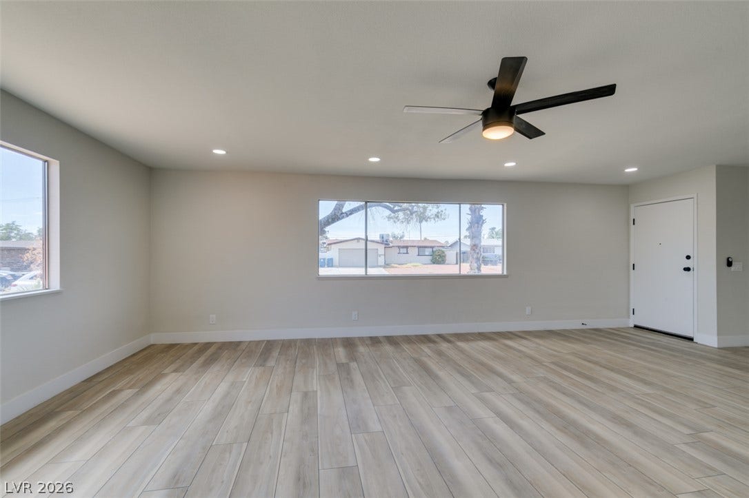 Streamlined modern finishes and neutral plank flooring define this airy entry space.