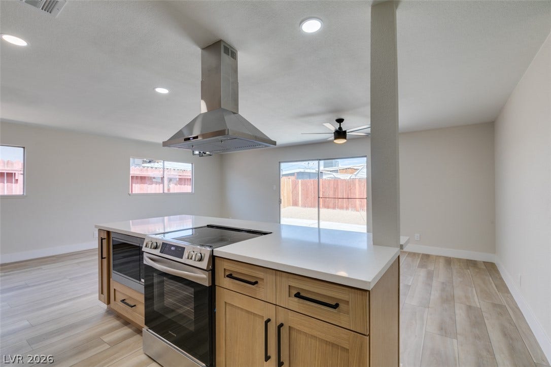 Clean lines and a spacious layout define this modern open-concept culinary space.