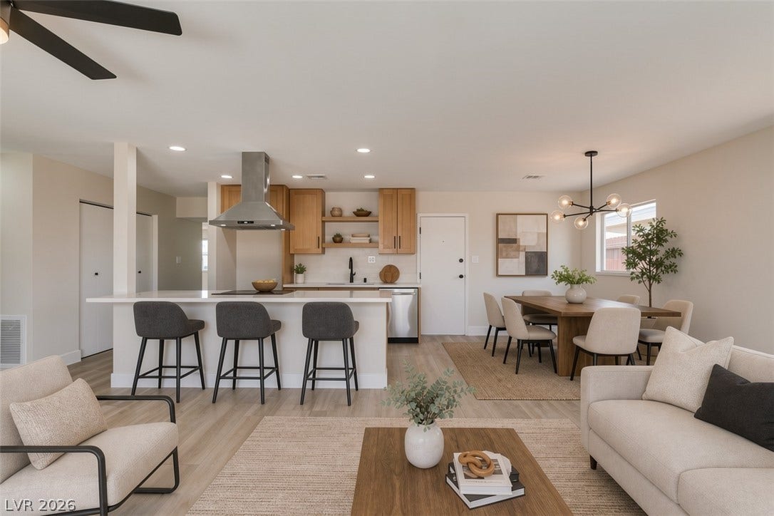 Virtually Staged Sunlight streams across the wood floors of this seamless open kitchen and dining layout.