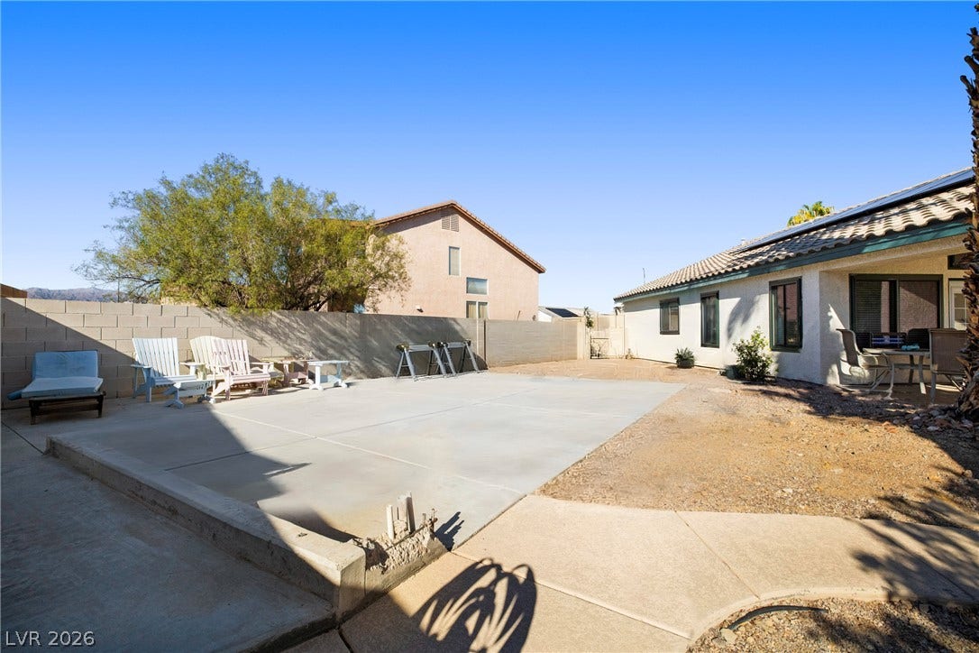 A spacious concrete RV Parking area under open desert skies provides plenty of space for outdoor living.