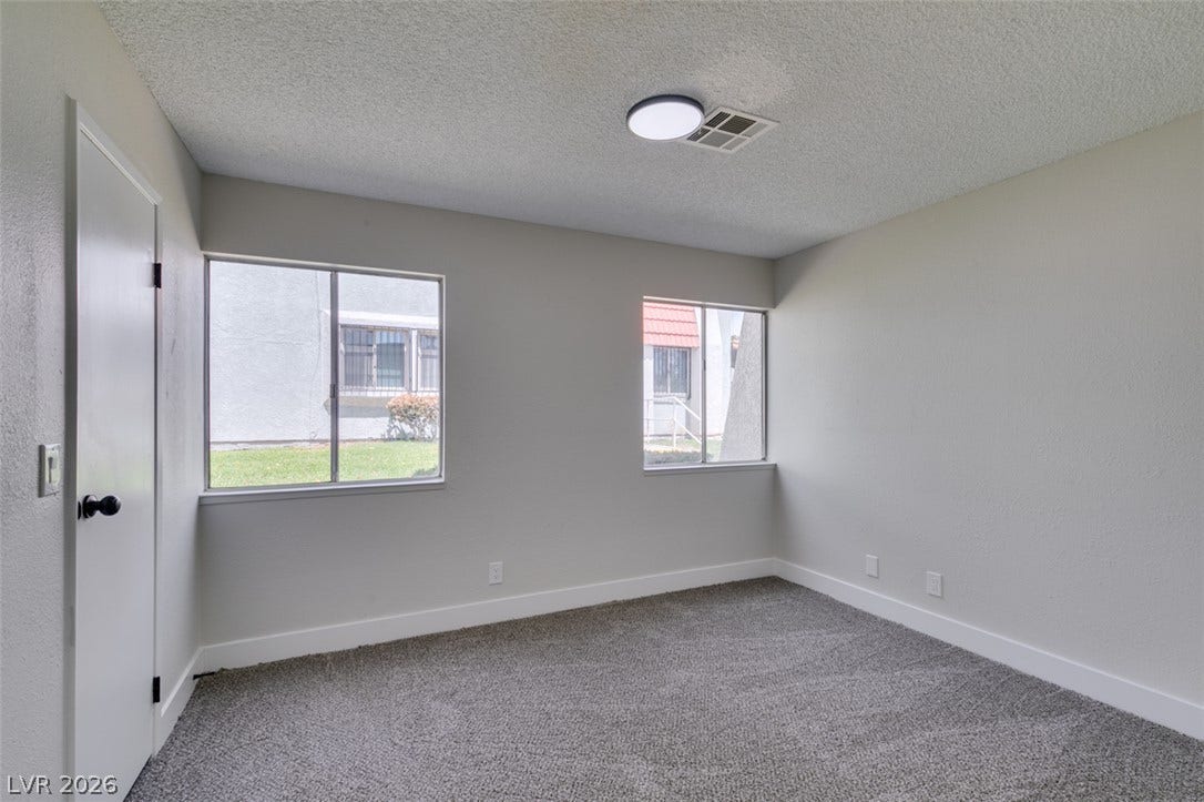 3638 Villa Knolls East Drive, Las Vegas, NV 89120 Plush carpeting and dual windows define this comfortable secondary bedroom.