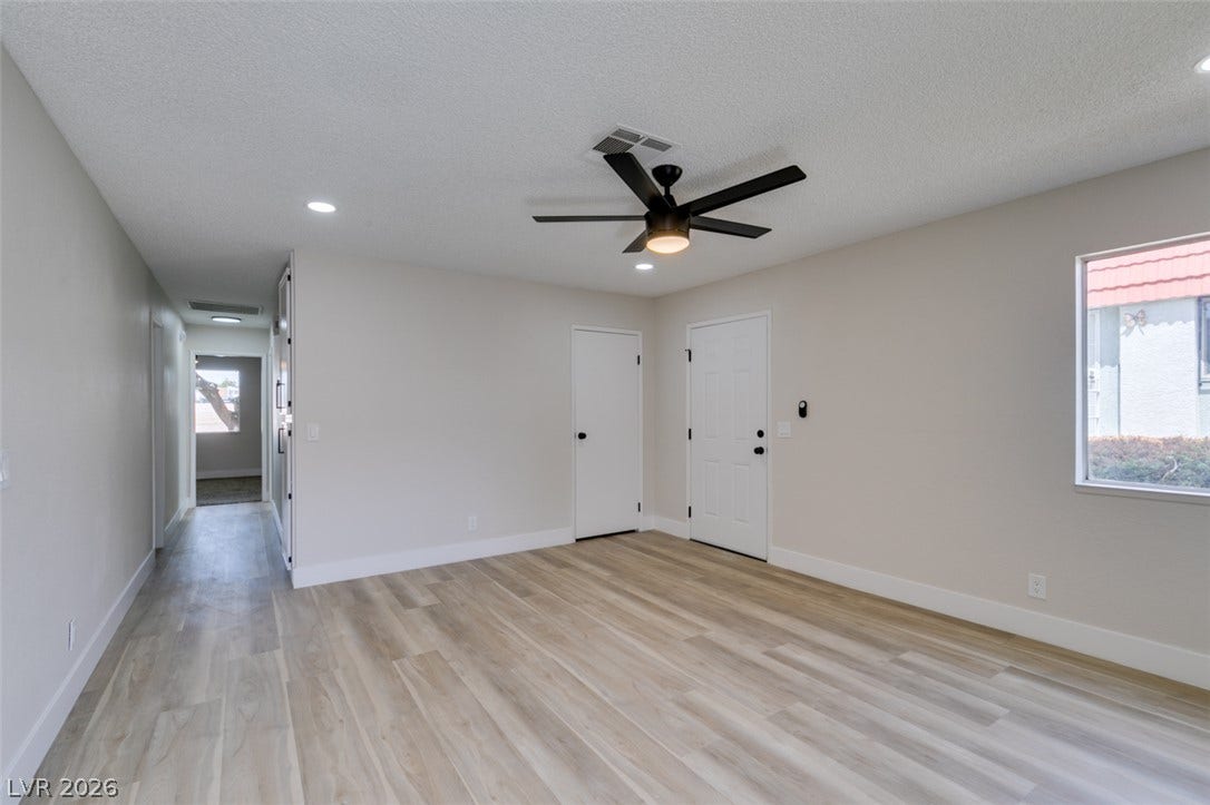 3638 Villa Knolls East Drive, Las Vegas, NV 89120 Smooth wood-look flooring and recessed lighting define this versatile open living space.
