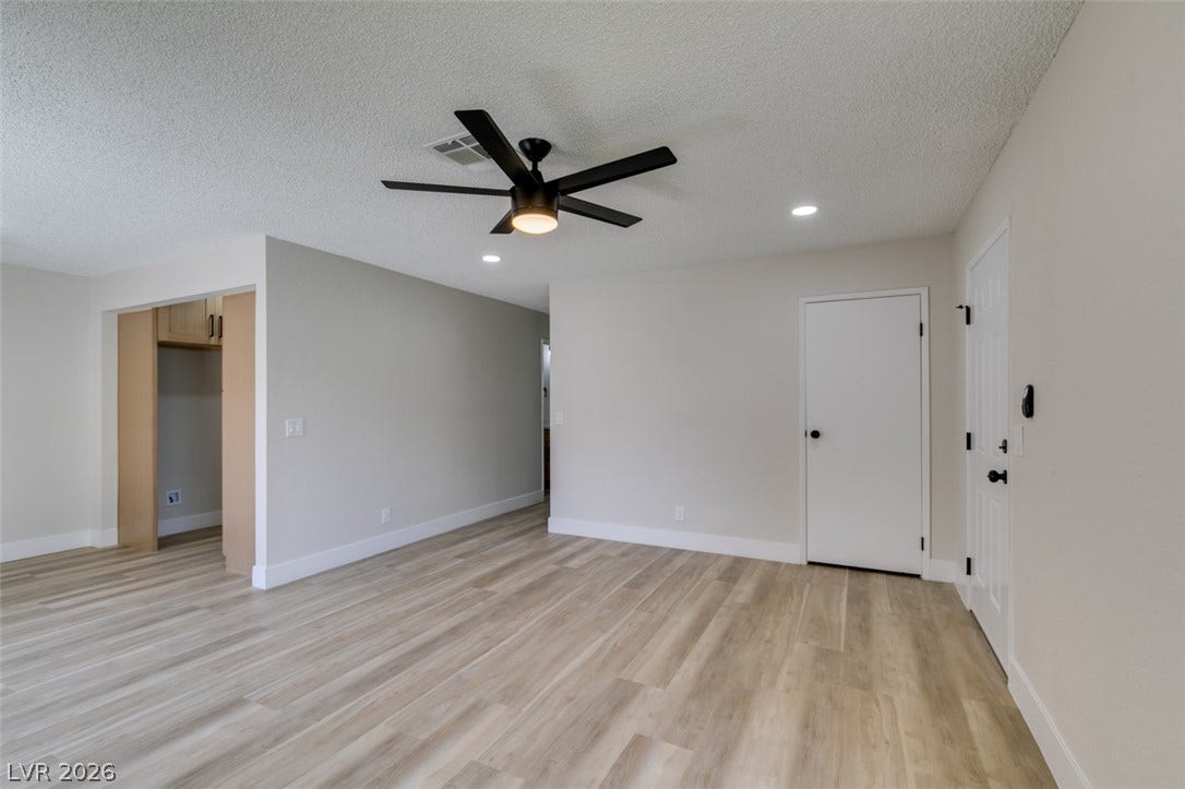 3638 Villa Knolls East Drive, Las Vegas, NV 89120 Smooth wood-look flooring and recessed lighting define this versatile open living space.