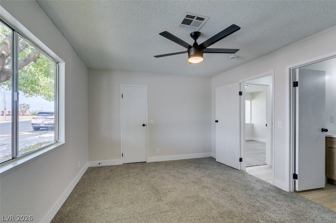 3638 Villa Knolls East Drive, Las Vegas, NV 89120 Plush carpeting and wide windows define this comfortable secondary bedroom suite.