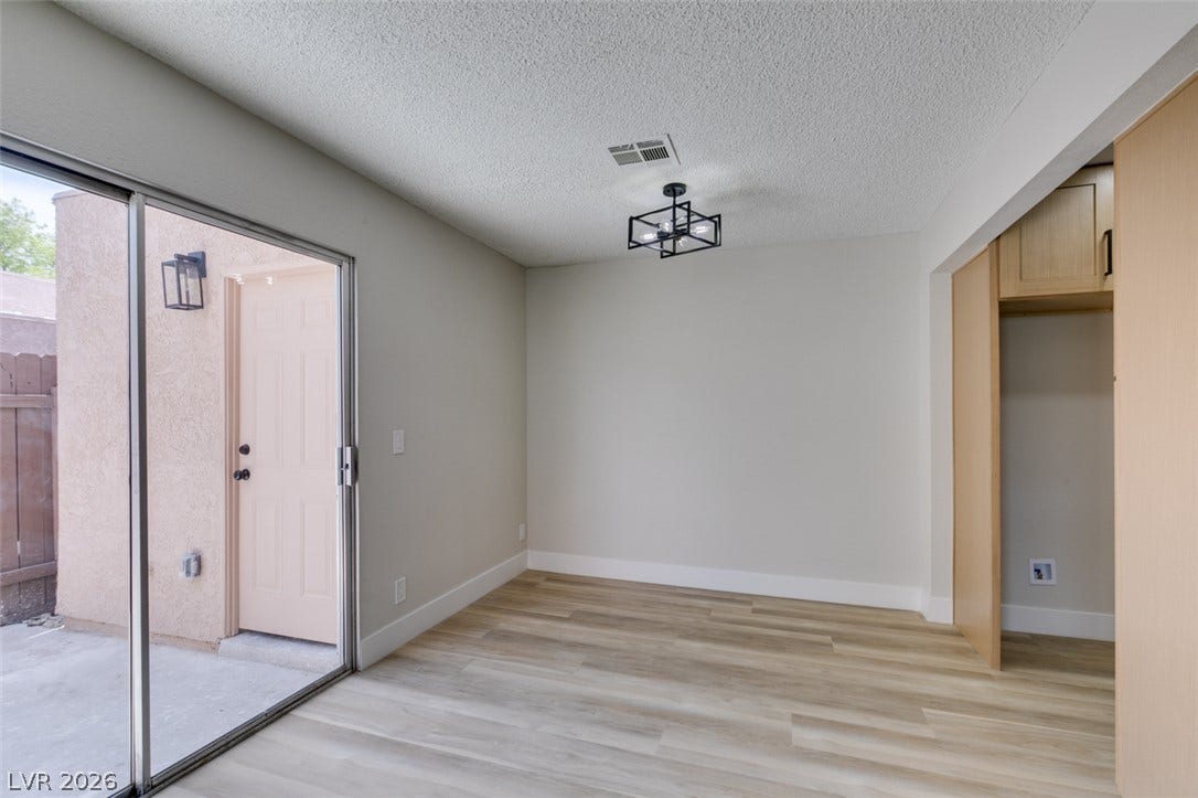 3638 Villa Knolls East Drive, Las Vegas, NV 89120 Sliding glass doors open directly to the outdoor patio from this versatile dining space.