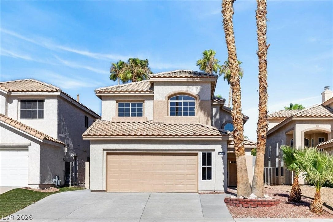 136 Villaggio Street, Henderson, NV 89074 Spanish tile roofing and classic stucco detailing highlight this multi-level residential design.