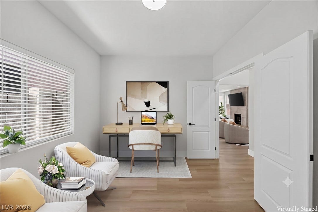 136 Villaggio Street, Henderson, NV 89074 Hardwood floors and a wide window create a focused, quiet workspace.