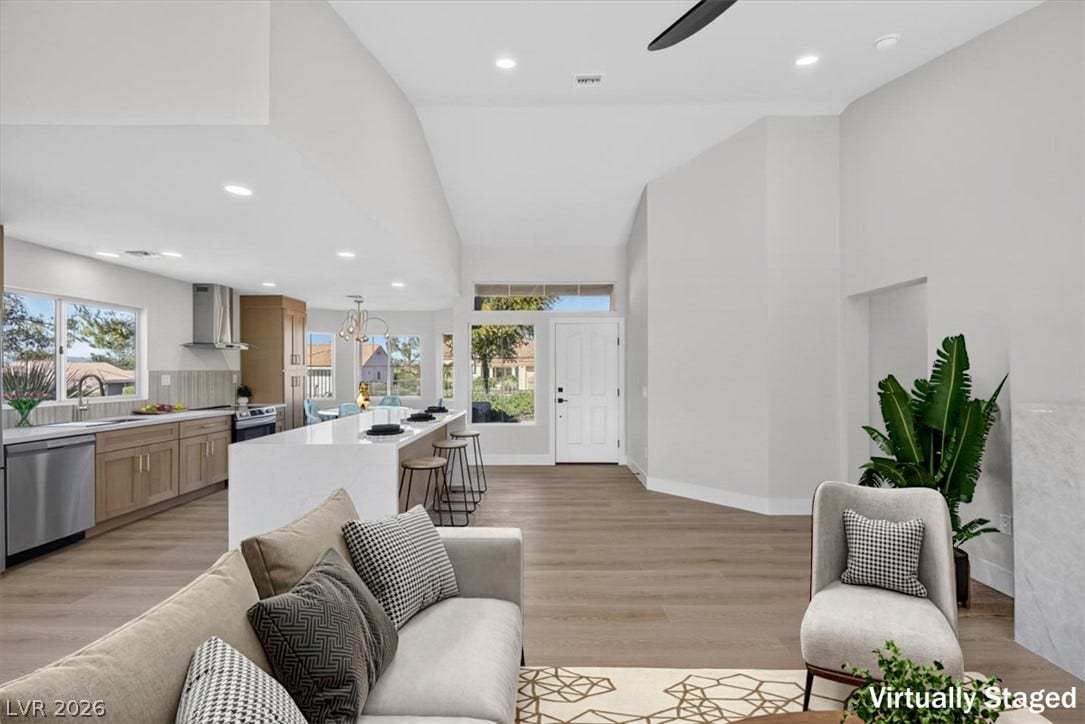 An open floorplan seamlessly connects the well-appointed kitchen with an inviting living space.