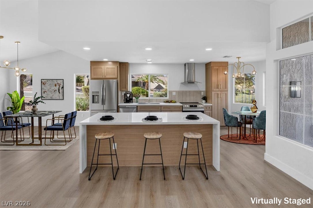 An open-concept kitchen and dining area provides an ideal setting for entertaining.
