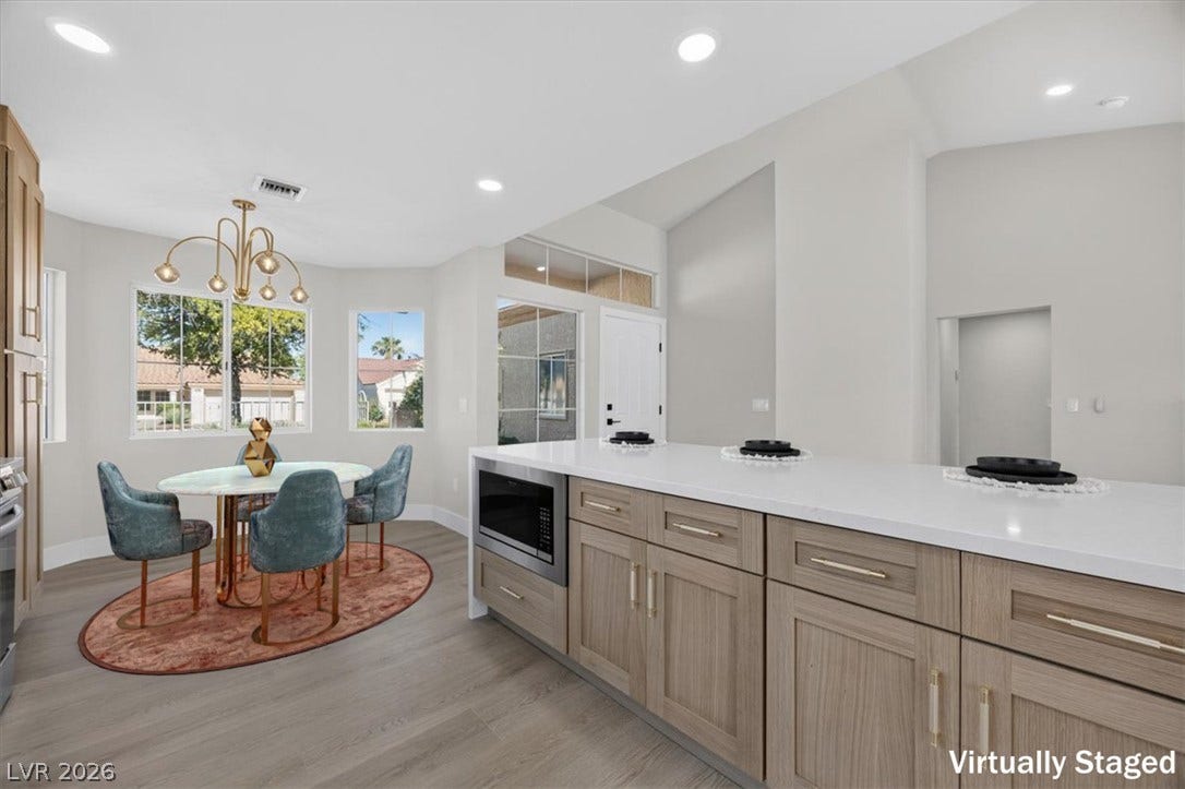 Culinary delights await in this bright kitchen with a convenient island and adjacent dining space.