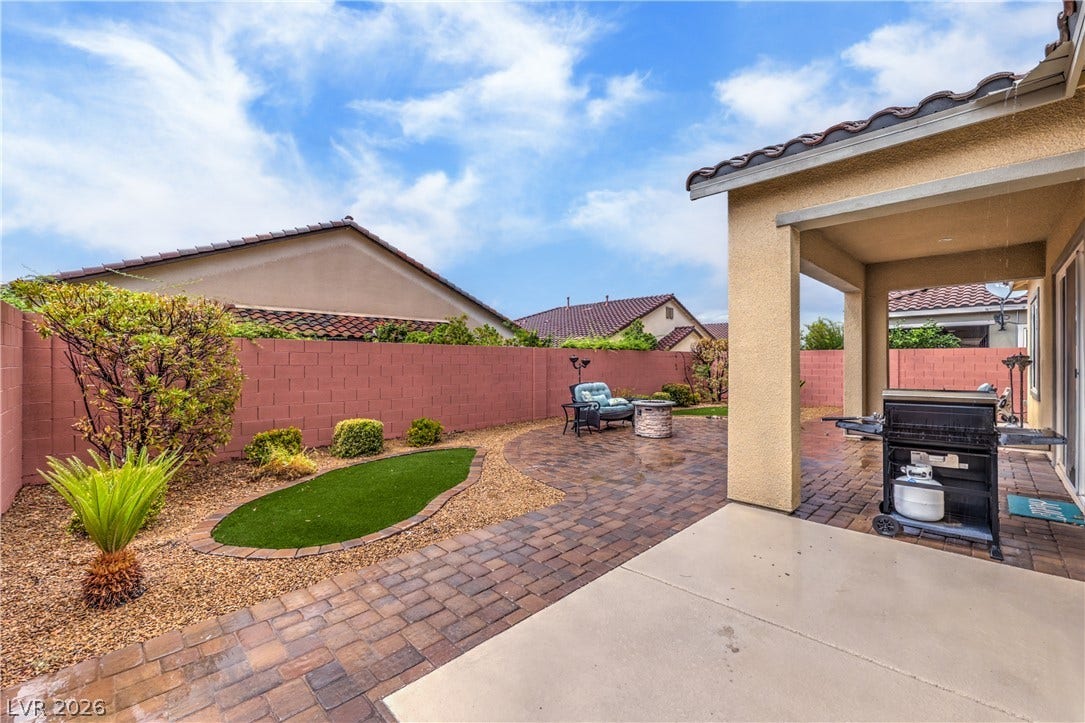 Low Maintenance Landscaping with Decorative Rock, Shrubs, and Trees with Automatic Irrigation System on a Timer