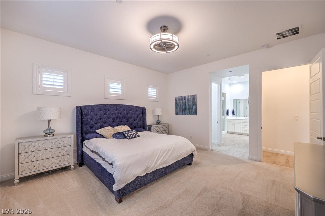 Owner's Suite features a Ceiling Fan, Walk-In Closet and Bathroom with Dual Sinks, Raised Vanity, Oversized Walk-In Shower, Linen Closet, and Comfort Height Toilet